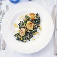 Seared scallops with flavoured greens image