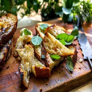 Grilled Garlic Bread With Basil and Parmesan Garlic, cheese and basil on bread is a classic to go with pasta, but this recipe is made on the grill. With few ingredients (and things to carry), it can b_image