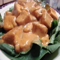 Tofu praram long song (tofu with peanut sauce on a bed of spinach)_image