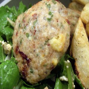 Chicken Tomato and Feta Patties on a Spinach Salad image