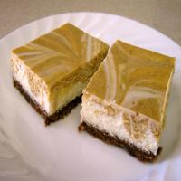 Marbled Pumpkin Cheesecake Bars With a Gingersnap Crust image