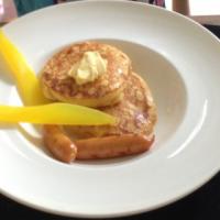 Best fluffy pancake ever served with orange maple syrup and veal sausage_image