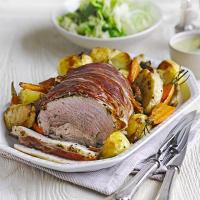 Herb roast pork with vegetable roasties & apple gravy image