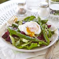 Asparagus salad with a runny poached egg image