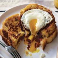 French Toast Stuffed with Bacon, Onion Tomato Jam with Gruyere, and a Fried Egg image