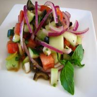 Cucumber Tomato Salad With Zucchini and Black Olives and a Lemon_image