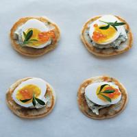 Chive Blini with Creme Fraiche, Quail Eggs, and Tarragon image