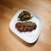 Strip Steak with Porcini Steak Sauce and Salsa Verde with Roasted Potatoes, Shallots and Green Beans_image