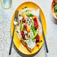 Fish Packets with Snap Peas, Tomatoes, and Herb Butter image