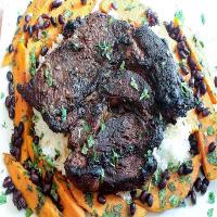 Cuban grilled chuck beef roast with grilled sweet potatoes and black beans image