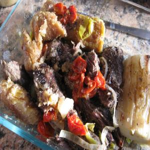 Baho (Beef, Plantains and Yuca Steamed in Banana Leaves) image