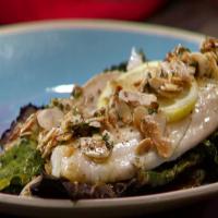 Branzino with Brown Butter and Almonds on a Bed of Crispy Kale image