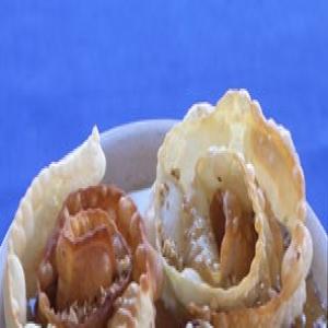 Fried Pastry Spirals with Honey, Sesame, and Walnuts image
