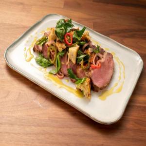 Pastrami Rubbed Smoked Boar with Grilled Rye and Quick Pickle Salad_image