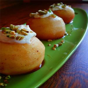 Poached Apples with Whipped Cream and Pistachios image
