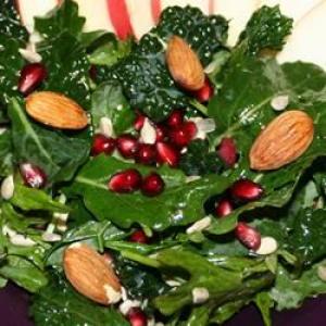 Kale Salad with Pomegranate, Sunflower Seeds and Sliced Almonds image