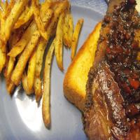 French Bistro Steak on Garlic Croutes and Potato Frites_image