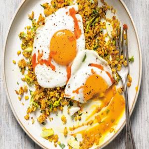 Crispy Brown Rice and Cauliflower with Fried Eggs image