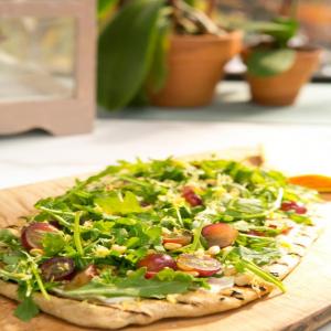 Ricotta, Arugula and Grape Pizza with Pine Nuts and Lemon Oil image