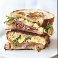Grilled Ham and Gouda Sandwiches with Frisée and Caramelized Onions image
