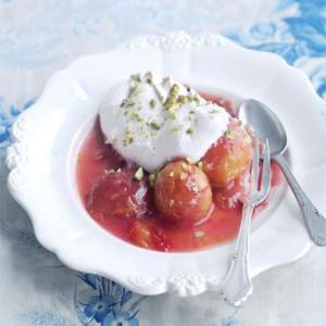 Syrupy plums with pistachio meringues image