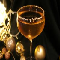 The Golden Bauble Cocktail with Prosecco, Amaretto, and Glitter_image