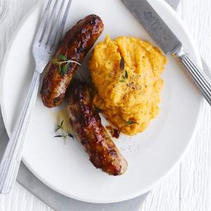Peppery sausages with sweet potato mash image