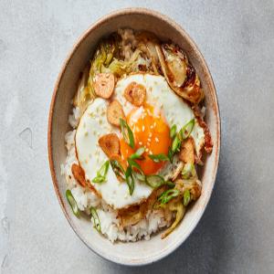 Stir-Fried Lettuce With Crispy Garlic and Fried Eggs image