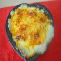 Quick and Easy Baked Stuffed Eggs With Cheese Sauce image
