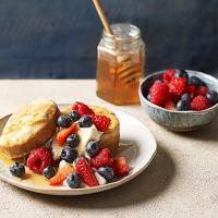 Homemade crumpets with ricotta, berries & thyme honey image