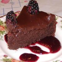 Decadent Chocolate Cake on a Bed of Raspberry Sauce_image