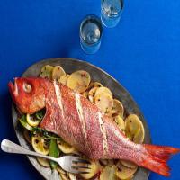 Whole Roasted Fish With Sliced Potatoes, Olives and Herbs_image