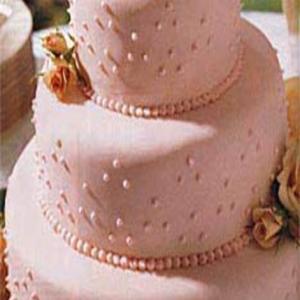 Fondant-Covered Wedding Cake with Raspberries and Chocolate_image