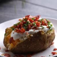 Microwave 10-minute Loaded Potato Recipe by Tasty image