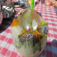 Frozen Festive Vodka or Tequila Bottles With Herbs and Berries image