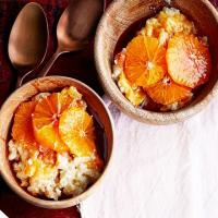 Baked cardamom-scented rice pudding with oranges in honey & pomegranate syrup image