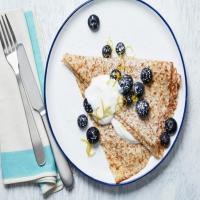 Thin Lemon Pancakes with Sweetened Sour Cream and Blueberries image