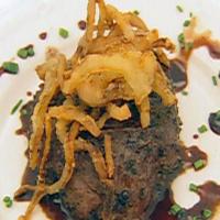 Peppercorn Encrusted Beef Tenderloin on Beef Tomato with Goat Cheese, French Fried Onions and Balsamic Vinegar Sauce image