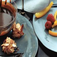 Chocolate Fondue with Candied Orange Peel, Raspberries, and Almond Macaroons image