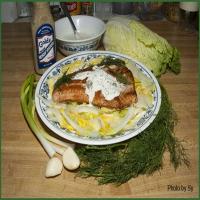 Salmon With a Creamy Sauce on a Bed of Greens_image