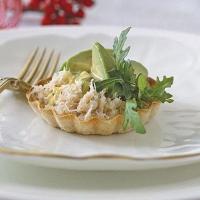 Crab, avocado & herby hollandaise tarts image