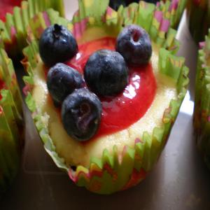 Cheesecake Cupcakes With Raspberry Sauce image