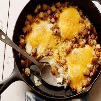 Baked Eggs with Farmhouse Cheddar and Potatoes image