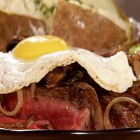 Beer Marinated T-Bone Steak, Sauteed Onions and Mushrooms, Topped with a Fried Egg_image