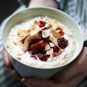 Spiced coconut porridge with cranberry & orange compote image