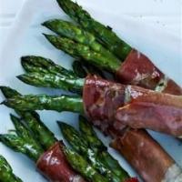 Asparagus spears baked in Parma ham image