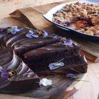 Giant Chocolate Cake with Bittersweet Chocolate Ganache and Edible Flowers image