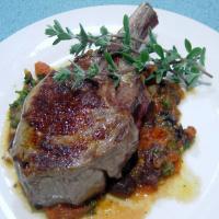Veal cutlets with olive, tomato and anchovy sauce image