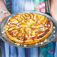 Peach puff pastry tart with almonds image