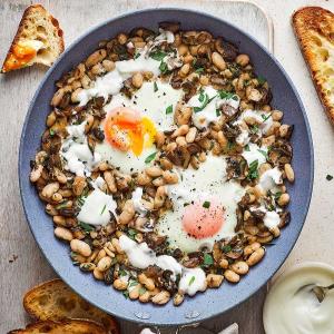 Baked eggs with beans, mushrooms, tarragon & crème fraîche_image